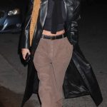 Hailey Bieber in a Black Leather Trench Coat Arrives for Churchome in Los Angeles 12/13/2023