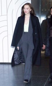 Phoebe Dynevor in a Black Coat