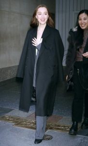 Phoebe Dynevor in a Black Coat