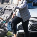Rebel Wilson in a Grey Vest Taking Her Baby Girl to a Friends House in Beverly Hills 12/28/2023