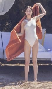 Dakota Johnson in a White Swimsuit