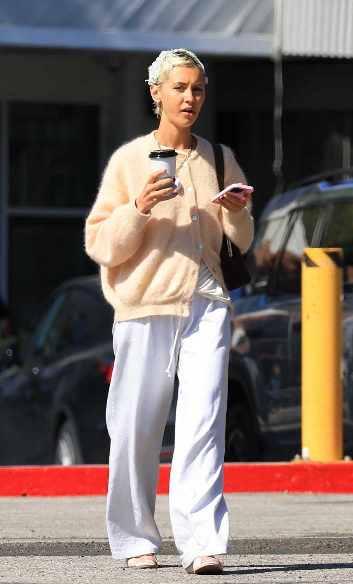 Iris Law in a White Sweatpants