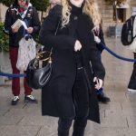 Kiernan Shipka in a Black Coat Arrives at a Hotel for Lunch During 2024 Paris Fashion Week in Paris 02/29/2024