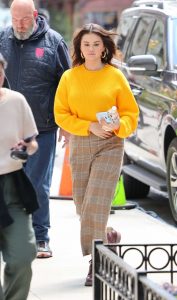 Selena Gomez in a Yellow Sweater