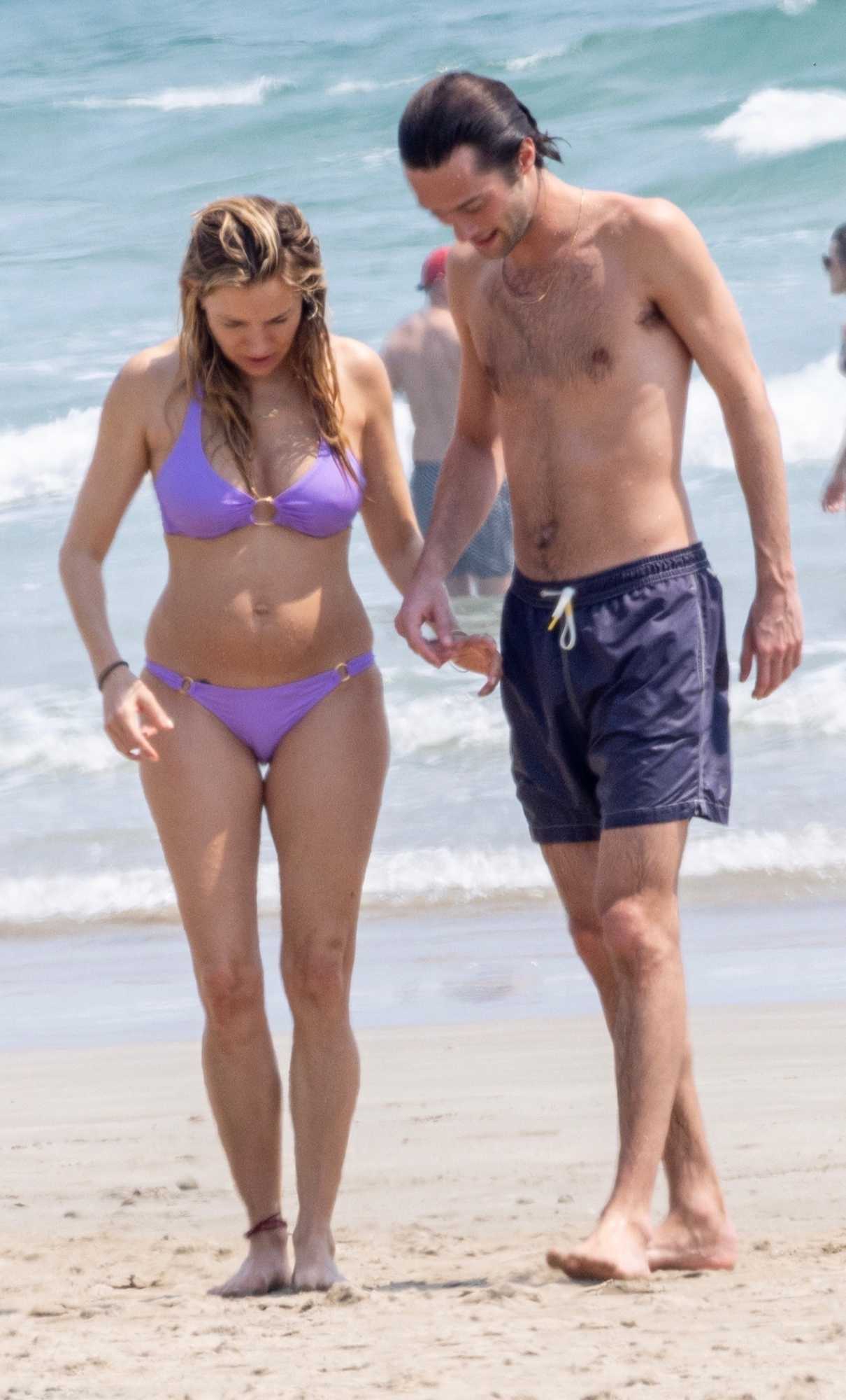 Sienna Miller in a Purple Bikini