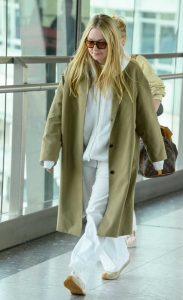 Dakota Fanning in an Olive Trench Coat