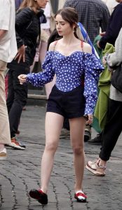 Lily Collins in a Blue Polka Dot Blouse