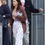 Millie Bobby Brown in a Brown Cardigan Was Spotted on a Morning Coffee Run in with Jake Bongiovi in New York City 05/13/2024