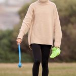 Rachael Finch in a Beige Sweater Walks Her Dog in Sydney 05/25/2024