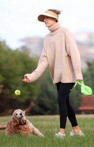 Rachael Finch in a Beige Sweater