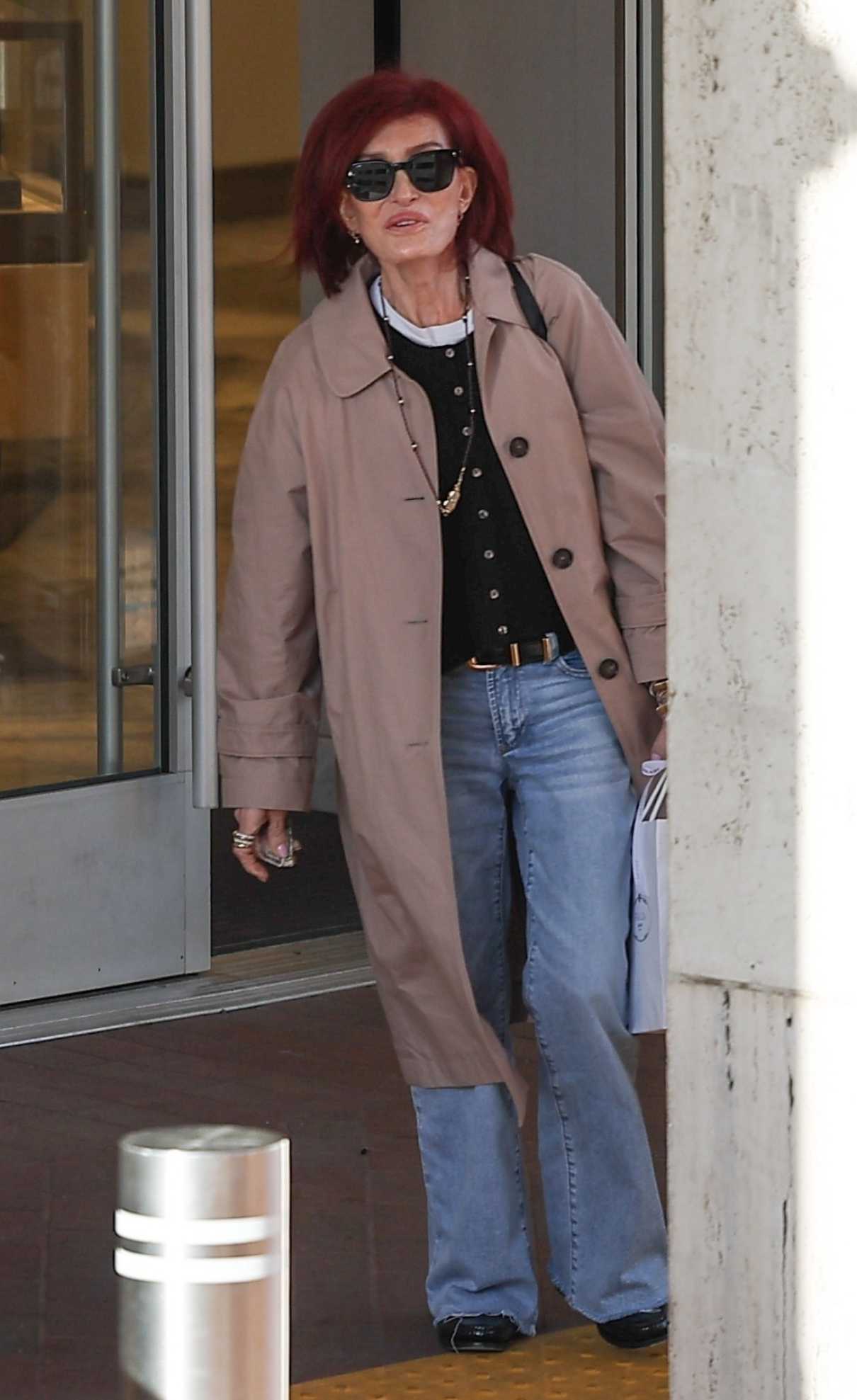 Sharon Osbourne in a Tan Trench Coat