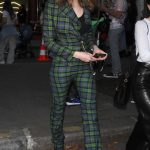 Cara Delevingne in a Plaid Green Pantsuit Leaves the Crazy Horse Show During 2024 Paris Fashion Week in Paris 06/24/2024
