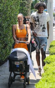 Draya Michele in an Orange Workout Ensemble