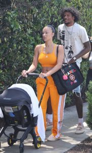 Draya Michele in an Orange Workout Ensemble