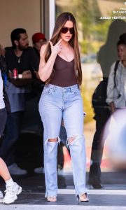 Khloe Kardashian in a Blue Ripped Jeans