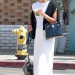 Laura Harrier in a White Tee Walks Her Dog in Los Angeles 05/31/2024