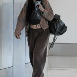 Noah Cyrus in a Brown Sweatpants Arrives at LAX Airport in Los Angeles 06/15/2024