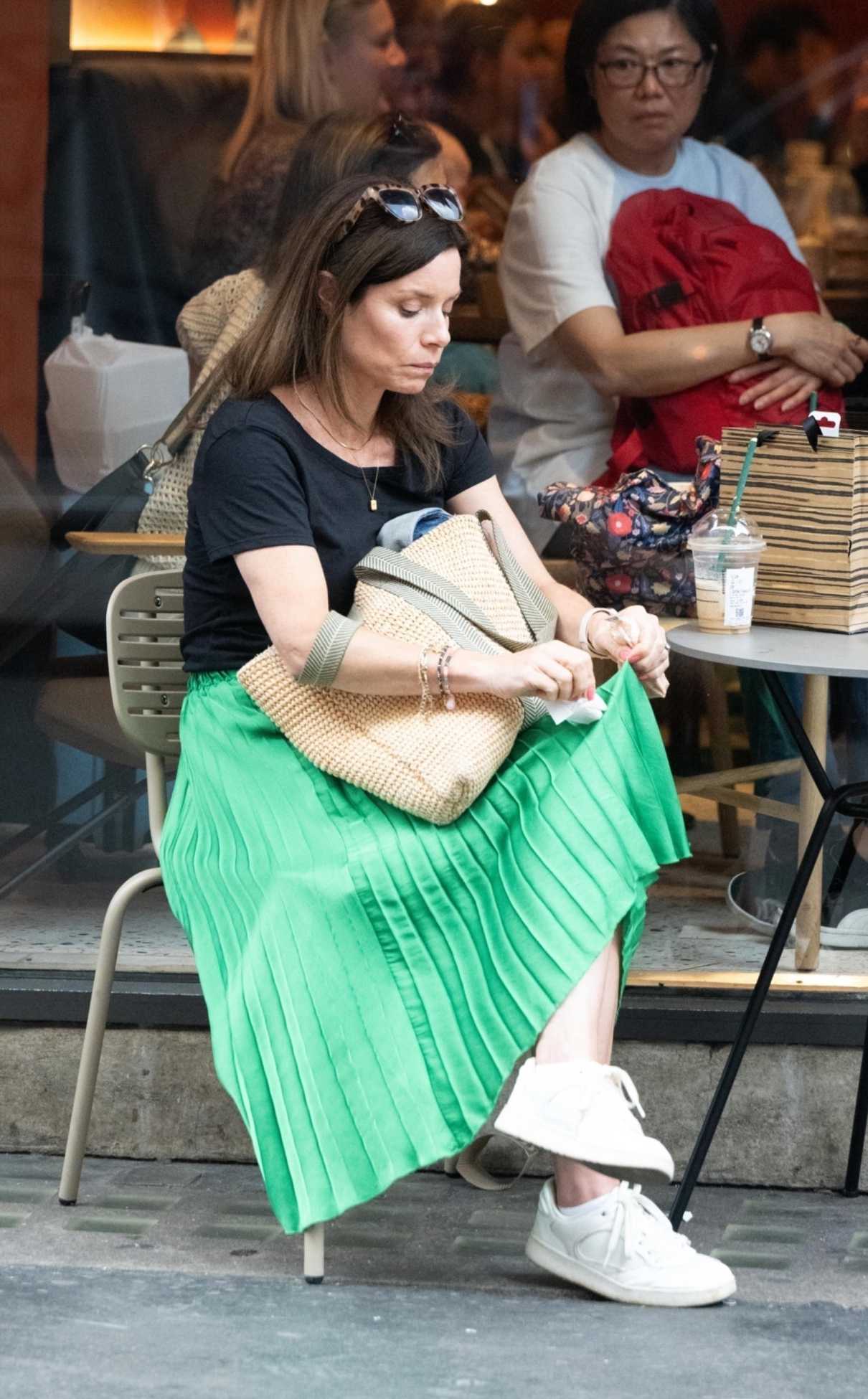 Anna Acton in a Green Skirt