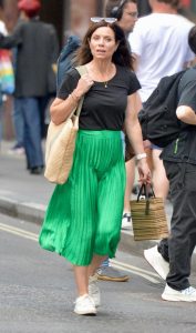 Anna Acton in a Green Skirt