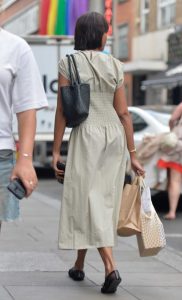 Sabrina Dhowre in a Beige Dress