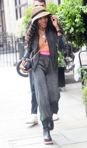 Sinitta in a Grey Sweatsuit