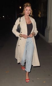 Chloe Sims in a Beige Trench Coat