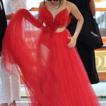 Jenna Ortega in a Red Dress Arrives at Hotel Excelsior at the 81st Venice International Film Festival in Venice 08/28/2024