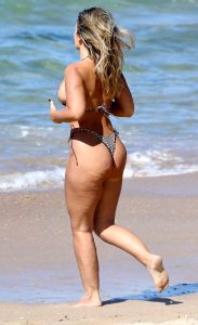 Natasha Oakley in a Barely There Bikini