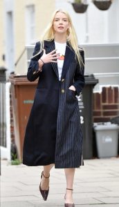 Anya Taylor-Joy in a Black Trench Coat