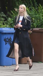 Anya Taylor-Joy in a Black Trench Coat