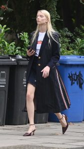 Anya Taylor-Joy in a Black Trench Coat