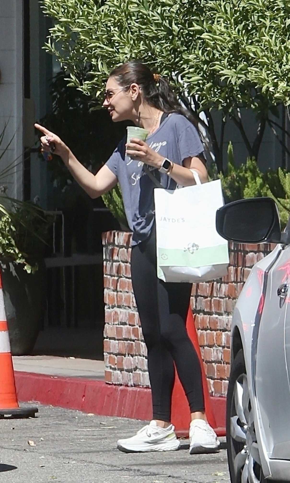 Mila Kunis in a White Sneakers