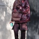 Irina Shayk in a Burgundy Puffer Jacket Catches a Taxi Cab in New York City 10/28/2024