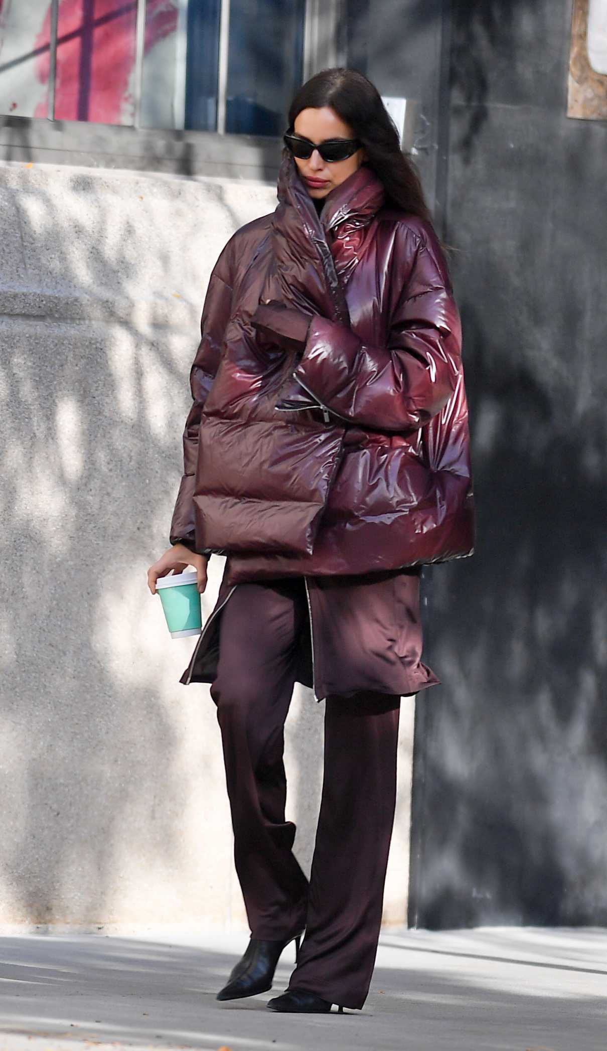 Irina Shayk in a Burgundy Puffer Jacket