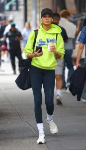 Joan Smalls in a Neon Green Hoodie