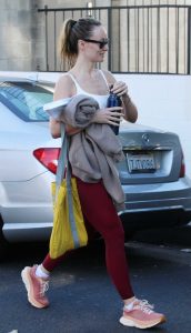 Olivia Wilde in a Red Leggings