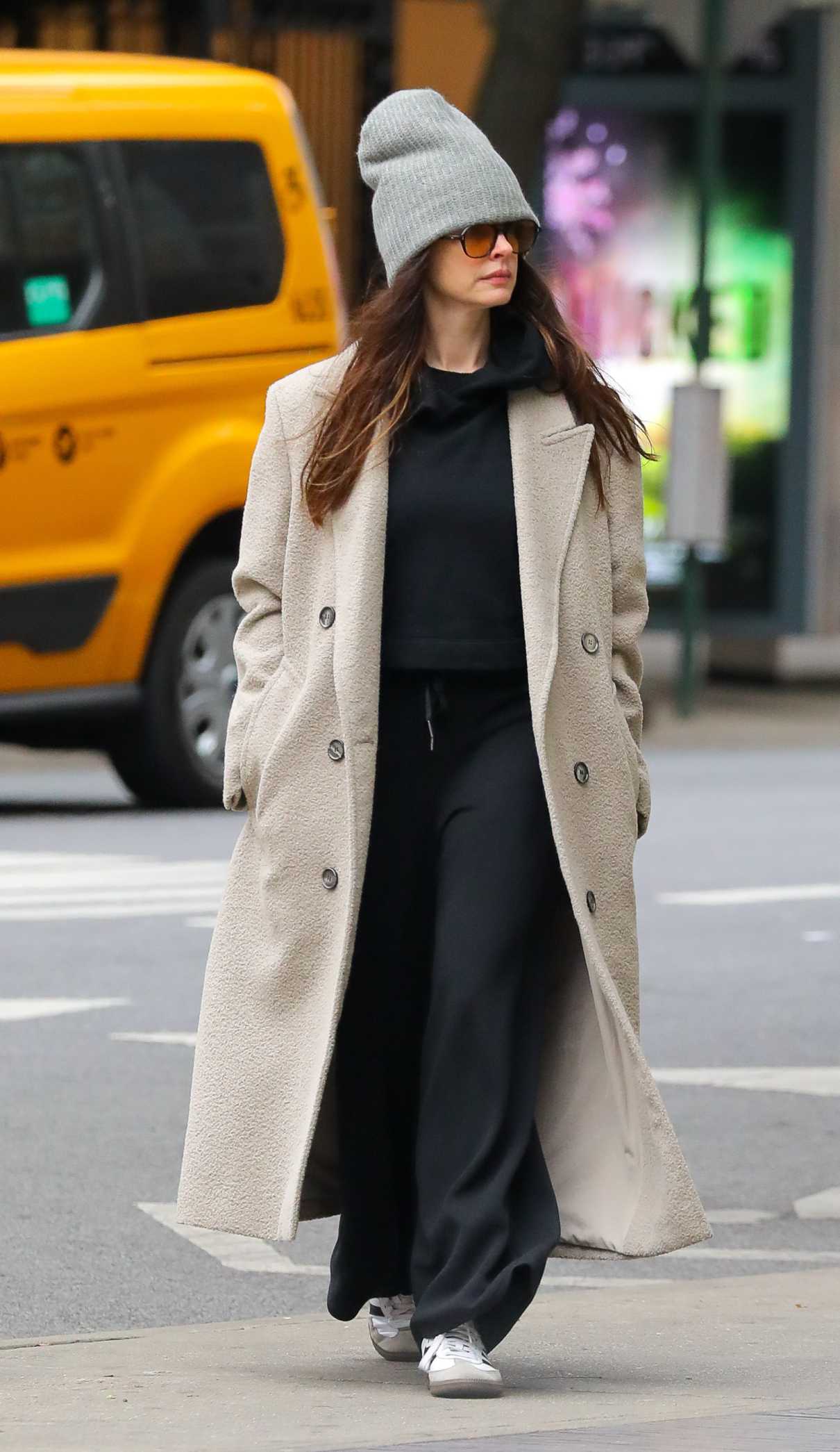 Anne Hathaway in a Beige Coat