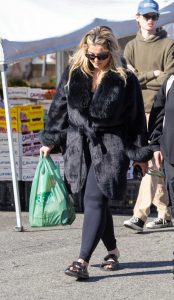 Bebe Rexha in a Black Fur Coat