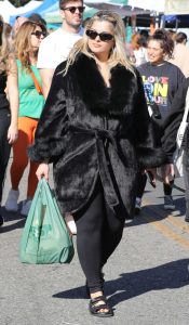 Bebe Rexha in a Black Fur Coat