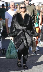 Bebe Rexha in a Black Fur Coat