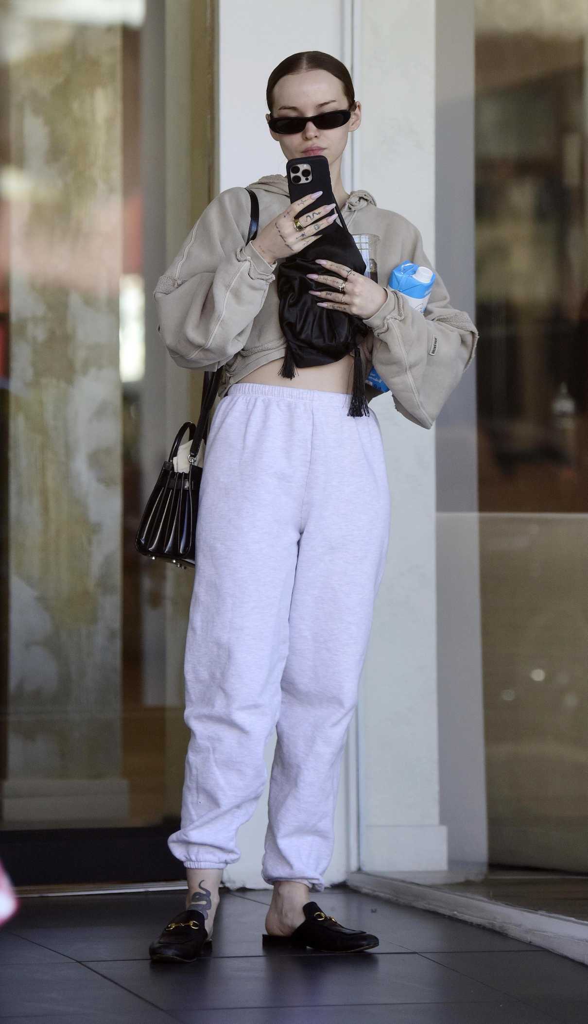 Dove Cameron in a White Sweatpants