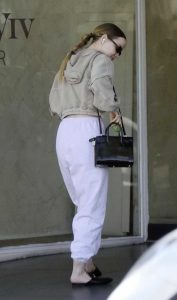 Dove Cameron in a White Sweatpants