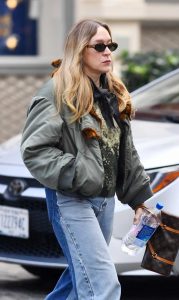 Chloe Sevigny in an Olive Bomber Jacket