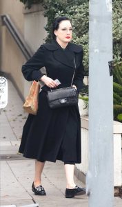 Dita Von Teese in a Black Coat