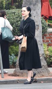 Dita Von Teese in a Black Coat