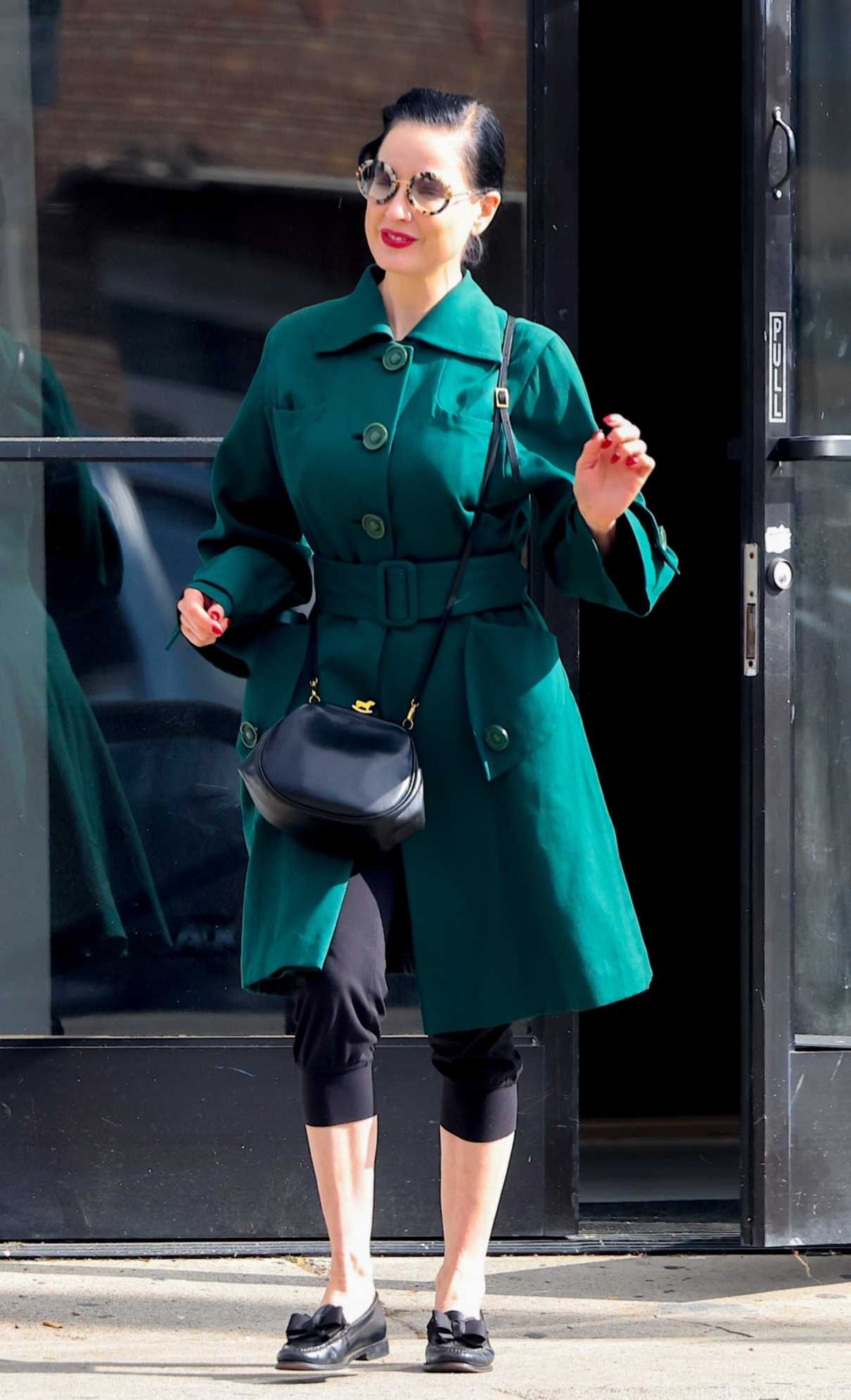 Dita Von Teese in a Turquoise Trench Coat