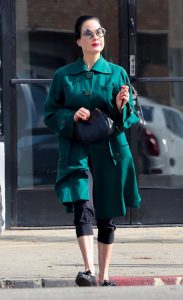 Dita Von Teese in a Turquoise Trench Coat