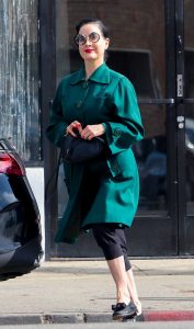 Dita Von Teese in a Turquoise Trench Coat