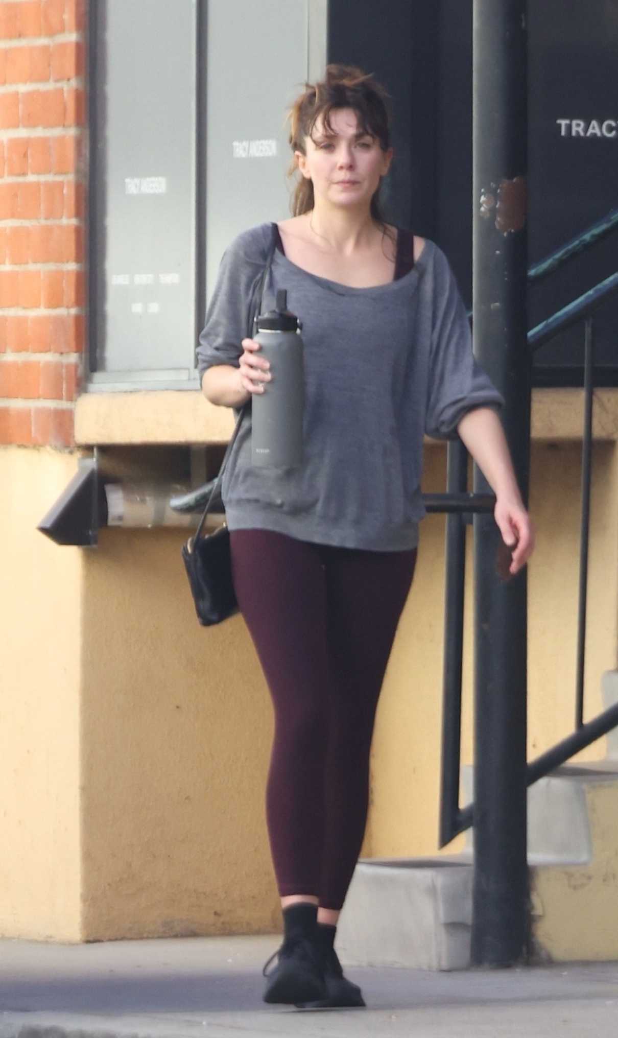 Elizabeth Olsen in a Black Sneakers