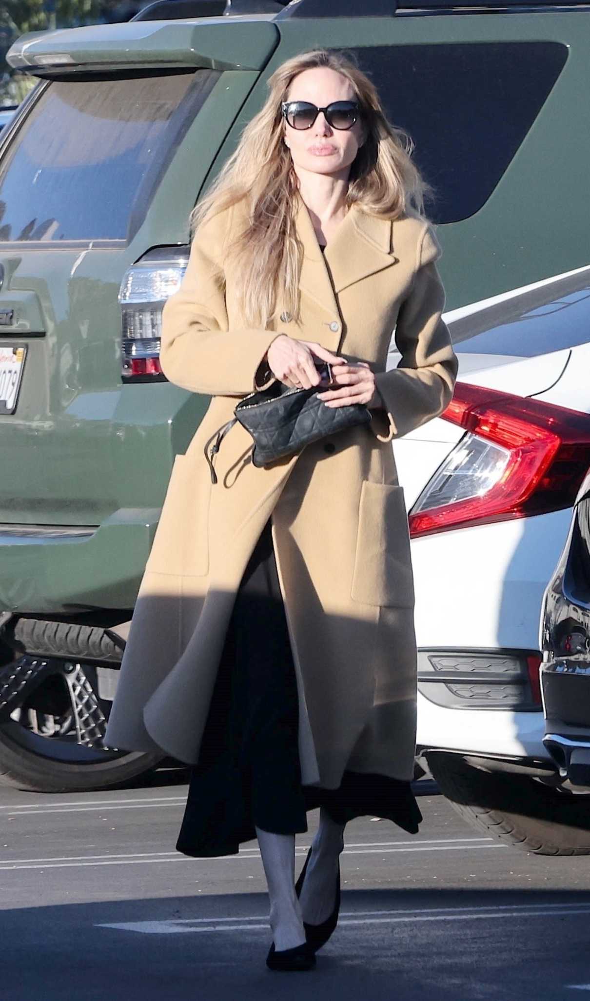 Angelina Jolie in a Beige Coat